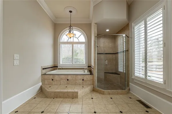 a view of an empty room with a ceiling fan