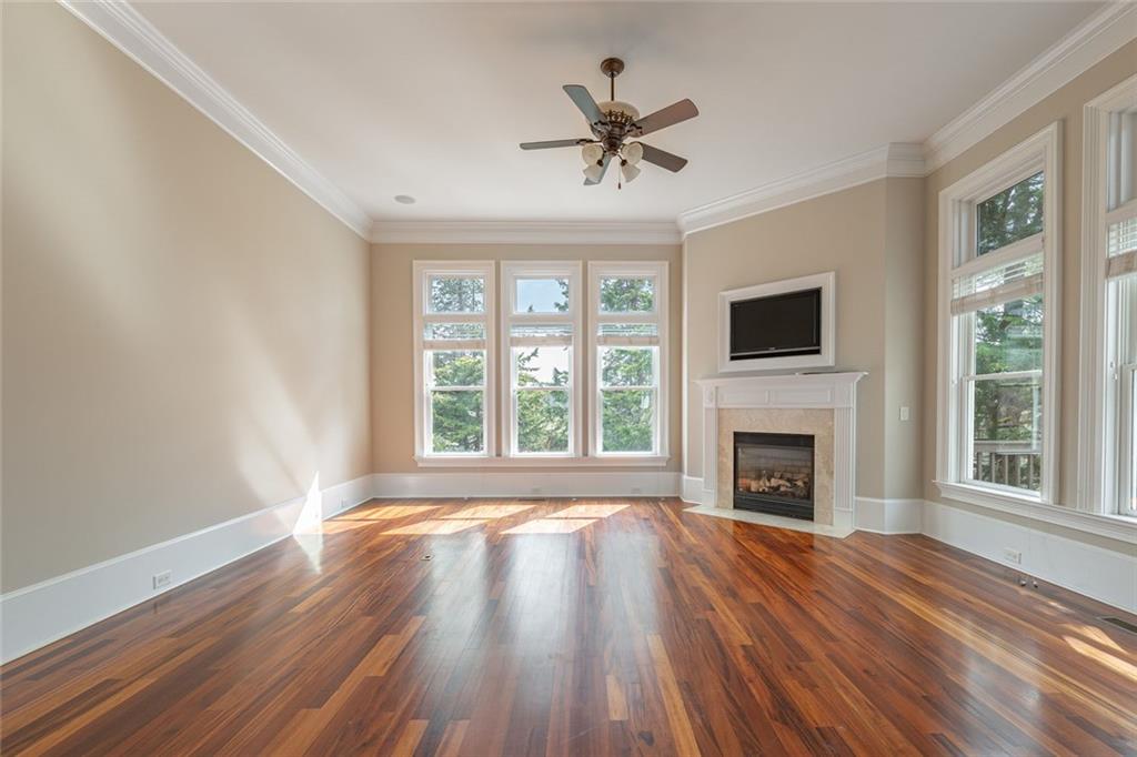 250 Frank Bruce Road Dawsonville, GA 30534 - Photo 33 of 110 a view of an empty room with wooden floor and a window