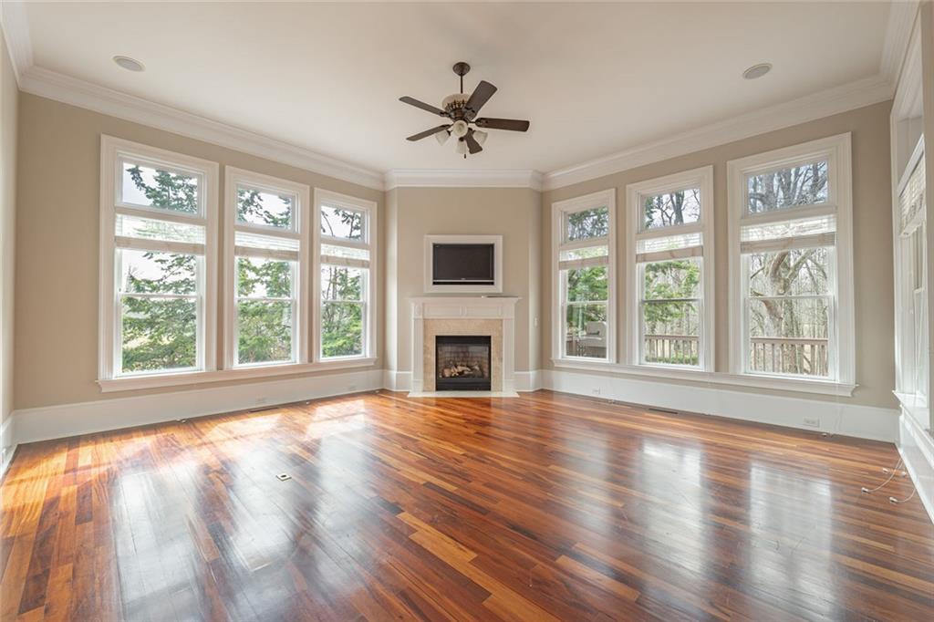 250 Frank Bruce Road Dawsonville, GA 30534 - Photo 34 of 110 a view of an empty room with wooden floor and a window