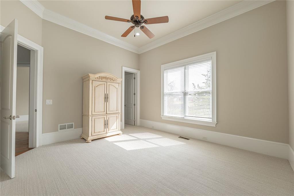 250 Frank Bruce Road Dawsonville, GA 30534 - Photo 36 of 110 a view of empty room with window and ceiling fan