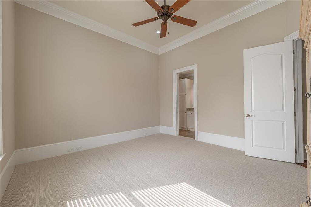250 Frank Bruce Road Dawsonville, GA 30534 - Photo 37 of 110 an empty room with a ceiling fan and carpet