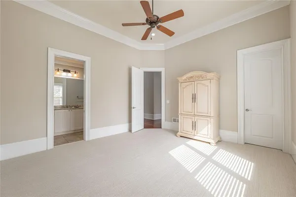 a spacious bathroom with a granite countertop sink a mirror and a shower