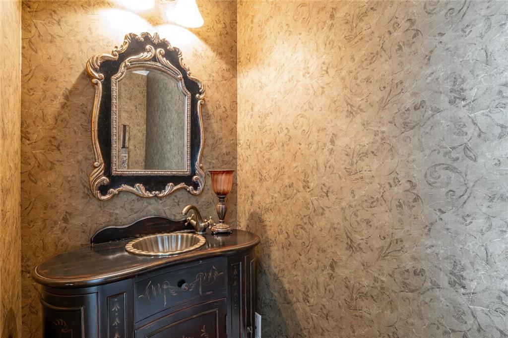 250 Frank Bruce Road Dawsonville, GA 30534 - Photo 42 of 110 a bathroom with a sink and a mirror