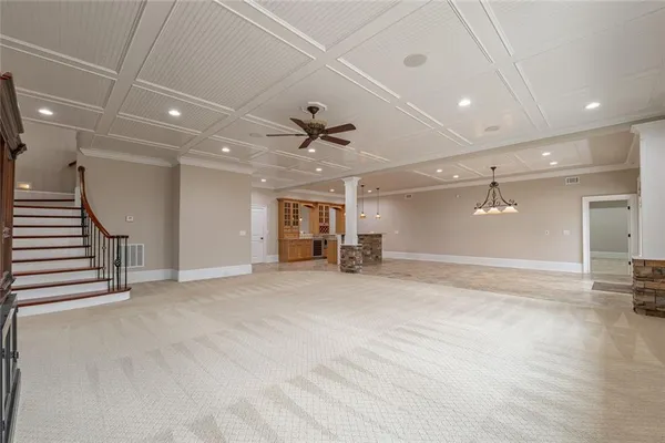 a view of an empty room with wooden walls