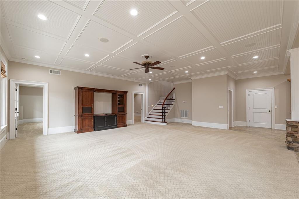 250 Frank Bruce Road Dawsonville, GA 30534 - Photo 48 of 110 an empty room with windows and a ceiling fan