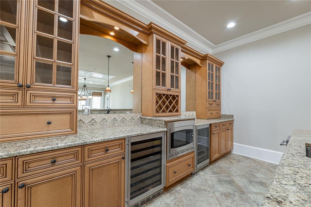 250 Frank Bruce Road Dawsonville, GA 30534 - Photo 51 of 110 a kitchen with stainless steel appliances granite countertop a stove and a sink