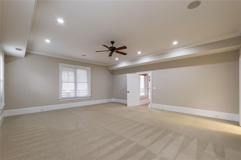 250 Frank Bruce Road Dawsonville, GA 30534 - Photo 57 of 110 an empty room with windows and ceiling fan