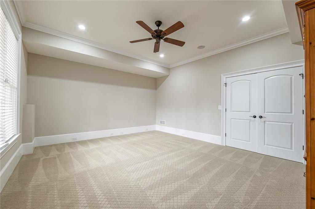 250 Frank Bruce Road Dawsonville, GA 30534 - Photo 63 of 110 an empty room with closet and ceiling fan