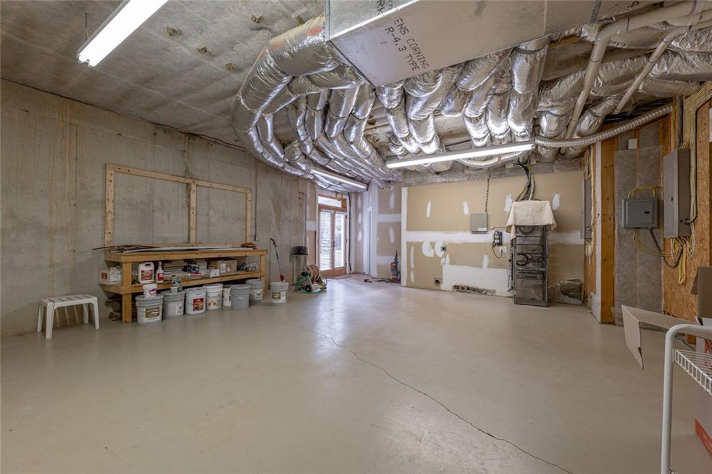 250 Frank Bruce Road Dawsonville, GA 30534 - Photo 69 of 110 a view of a livingroom with furniture and a garage