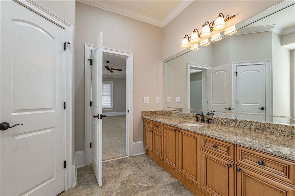250 Frank Bruce Road Dawsonville, GA 30534 - Photo 70 of 110 a spacious bathroom with a granite countertop sink a mirror and a shower