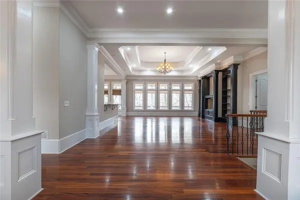 a kitchen with stainless steel appliances granite countertop a sink a stove and wooden floor