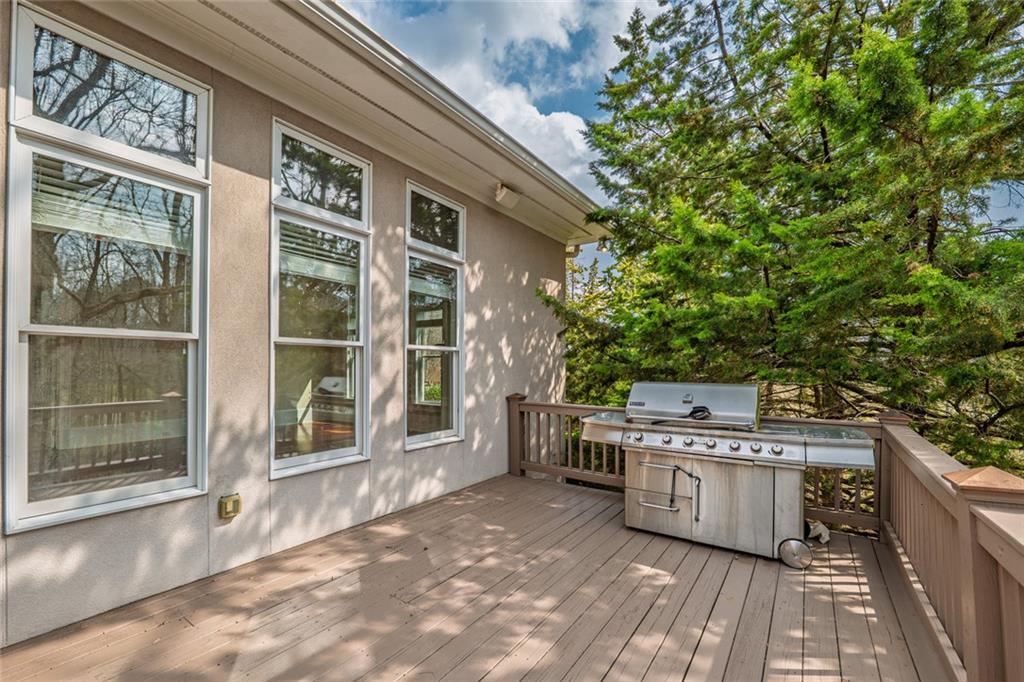 250 Frank Bruce Road Dawsonville, GA 30534 - Photo 84 of 110 a view of a kitchen with stainless steel appliances wooden floor and brick wall