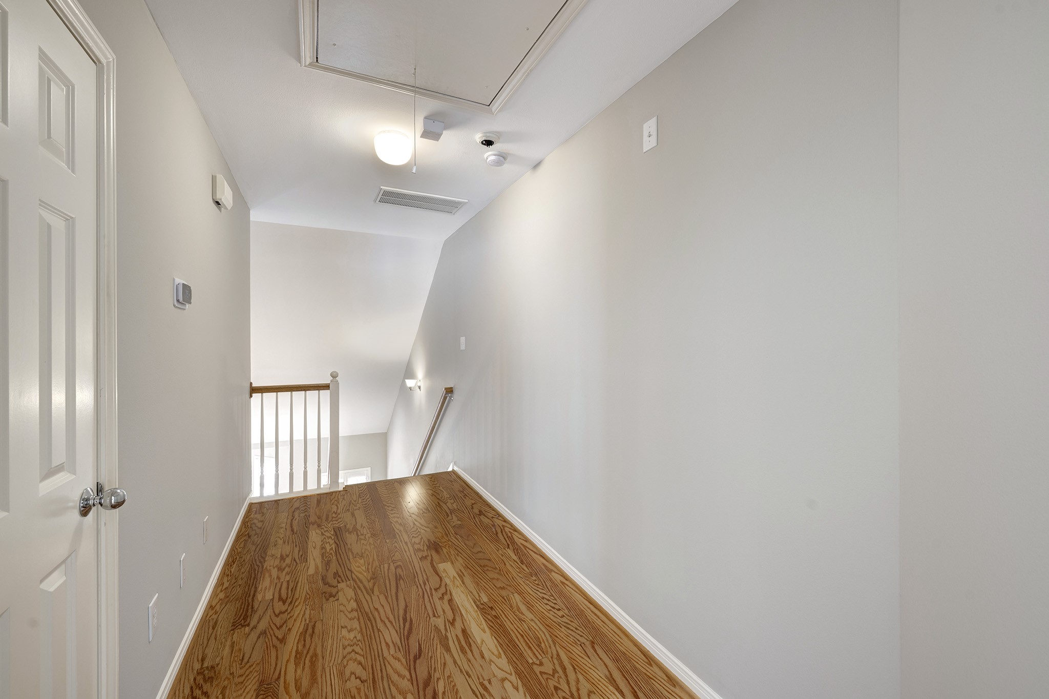 2915 West Dallas Street Houston, TX 77019 - Photo 11 of 17 a view of a hallway with wooden floor