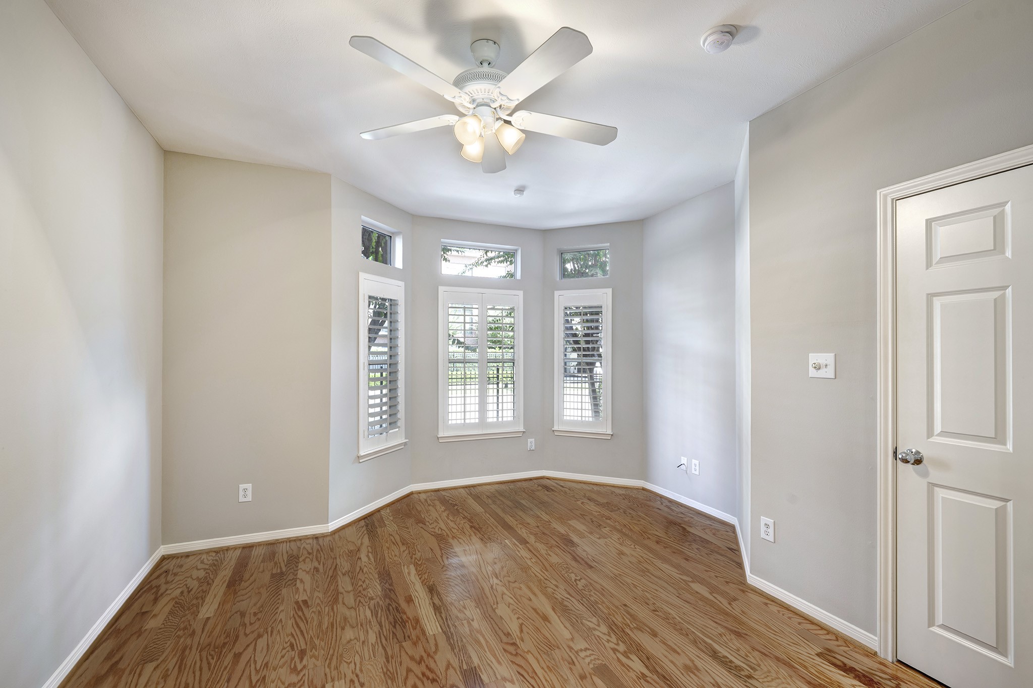2915 West Dallas Street Houston, TX 77019 - Photo 14 of 17 wooden floor in an empty room with a window