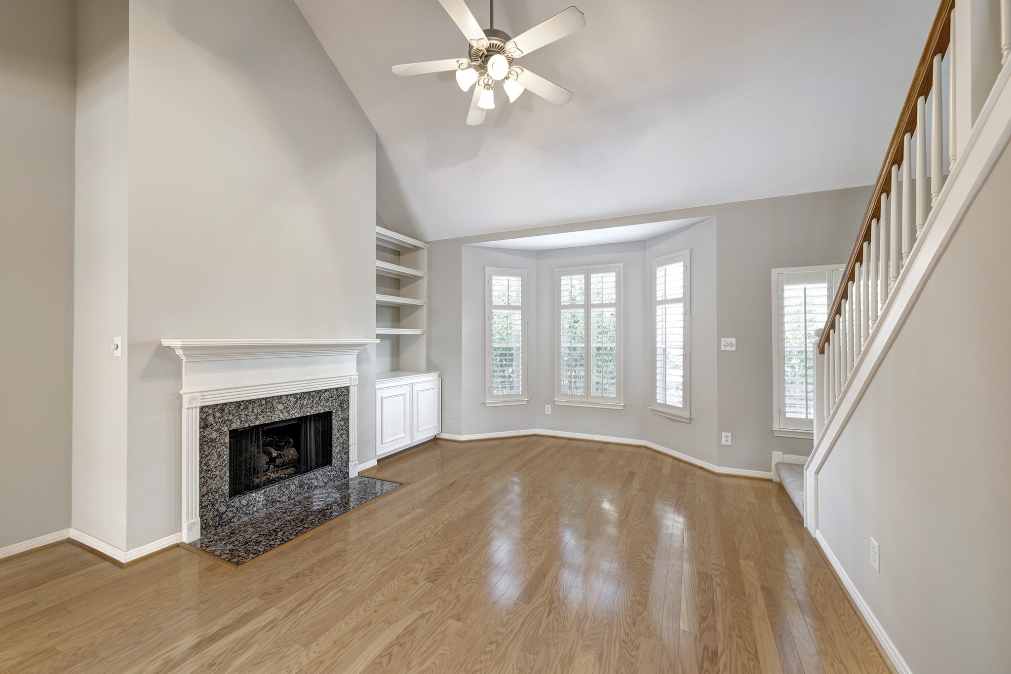 2915 West Dallas Street Houston, TX 77019 - Photo 8 of 17 a view of an empty room with chandelier fan and fire place