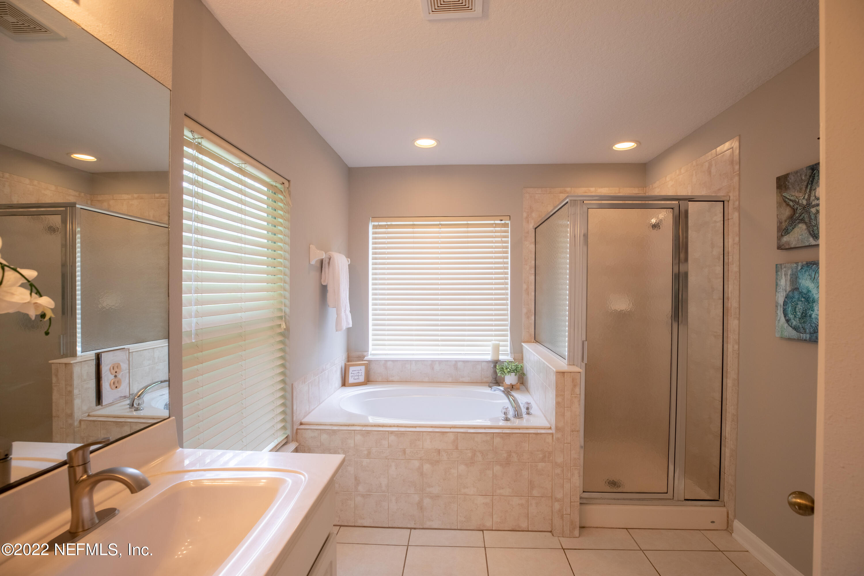 2067 North Cranbrook Avenue St. Augustine, FL 32092 - Photo 17 of 26 a bathroom with a tub a sink and a shower