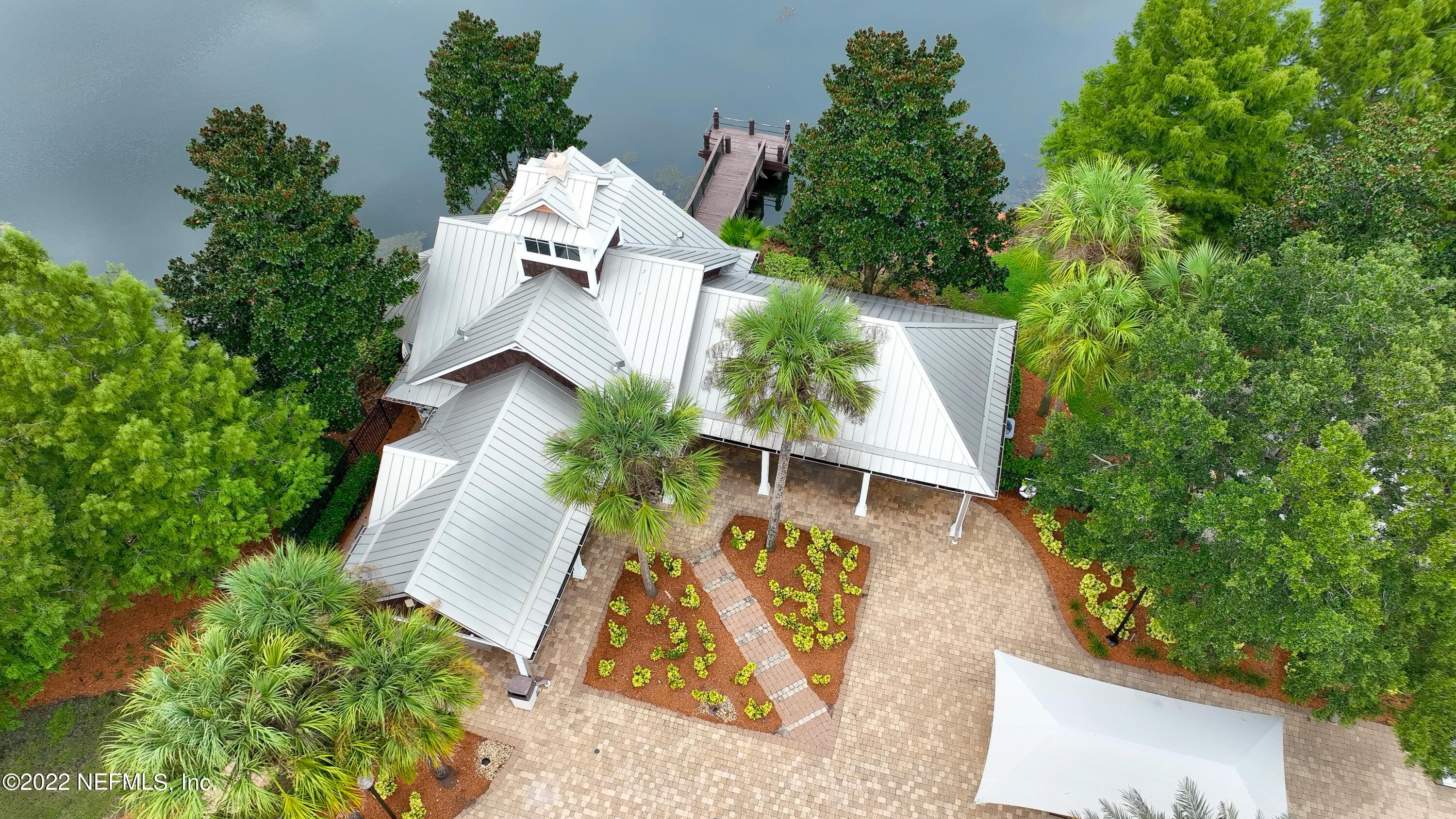 2067 North Cranbrook Avenue St. Augustine, FL 32092 - Photo 22 of 26 an aerial view of a house with a yard and trees