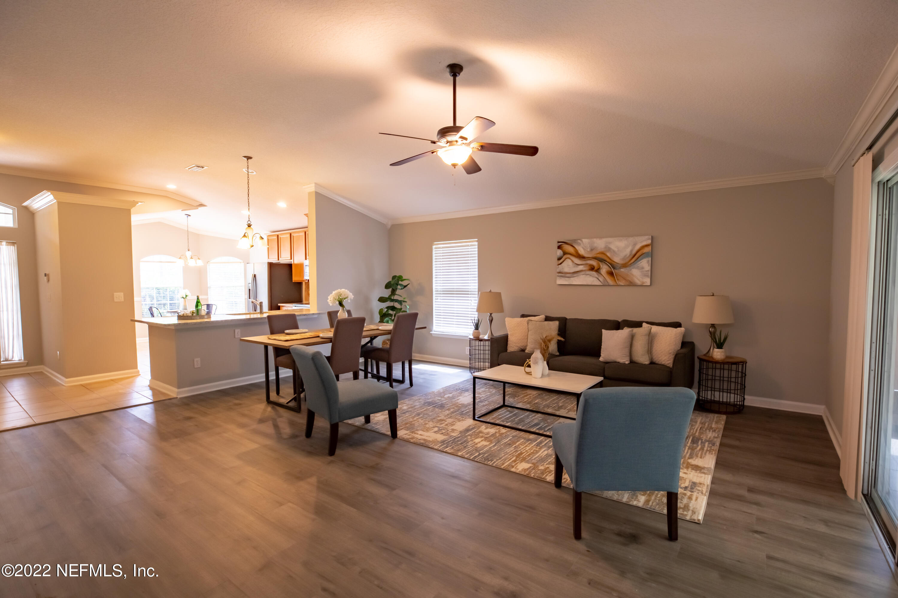 2067 North Cranbrook Avenue St. Augustine, FL 32092 - Photo 3 of 26 a living room with furniture and a chandelier