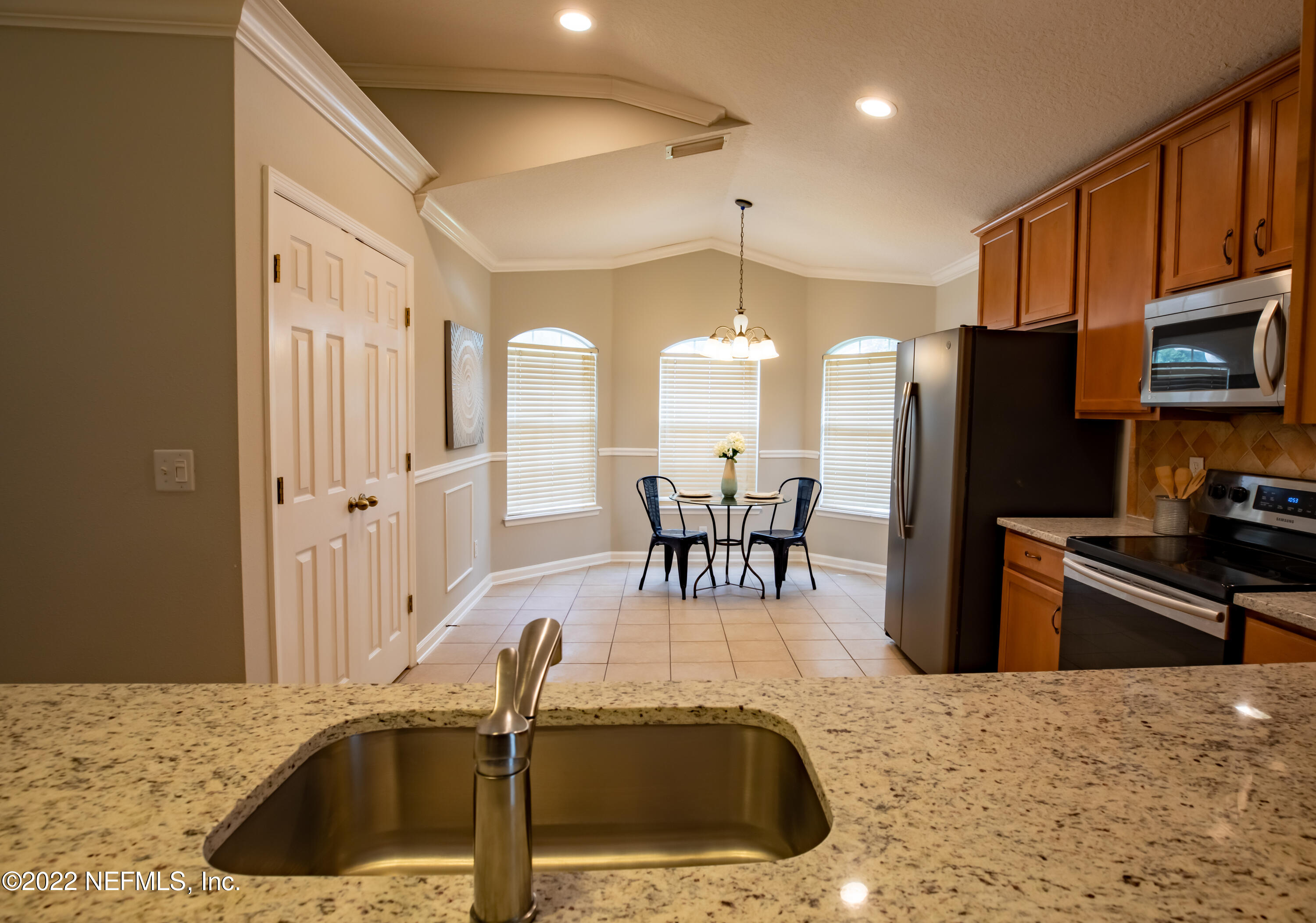 2067 North Cranbrook Avenue St. Augustine, FL 32092 - Photo 10 of 26 a kitchen with stainless steel appliances granite countertop a sink refrigerator and cabinets