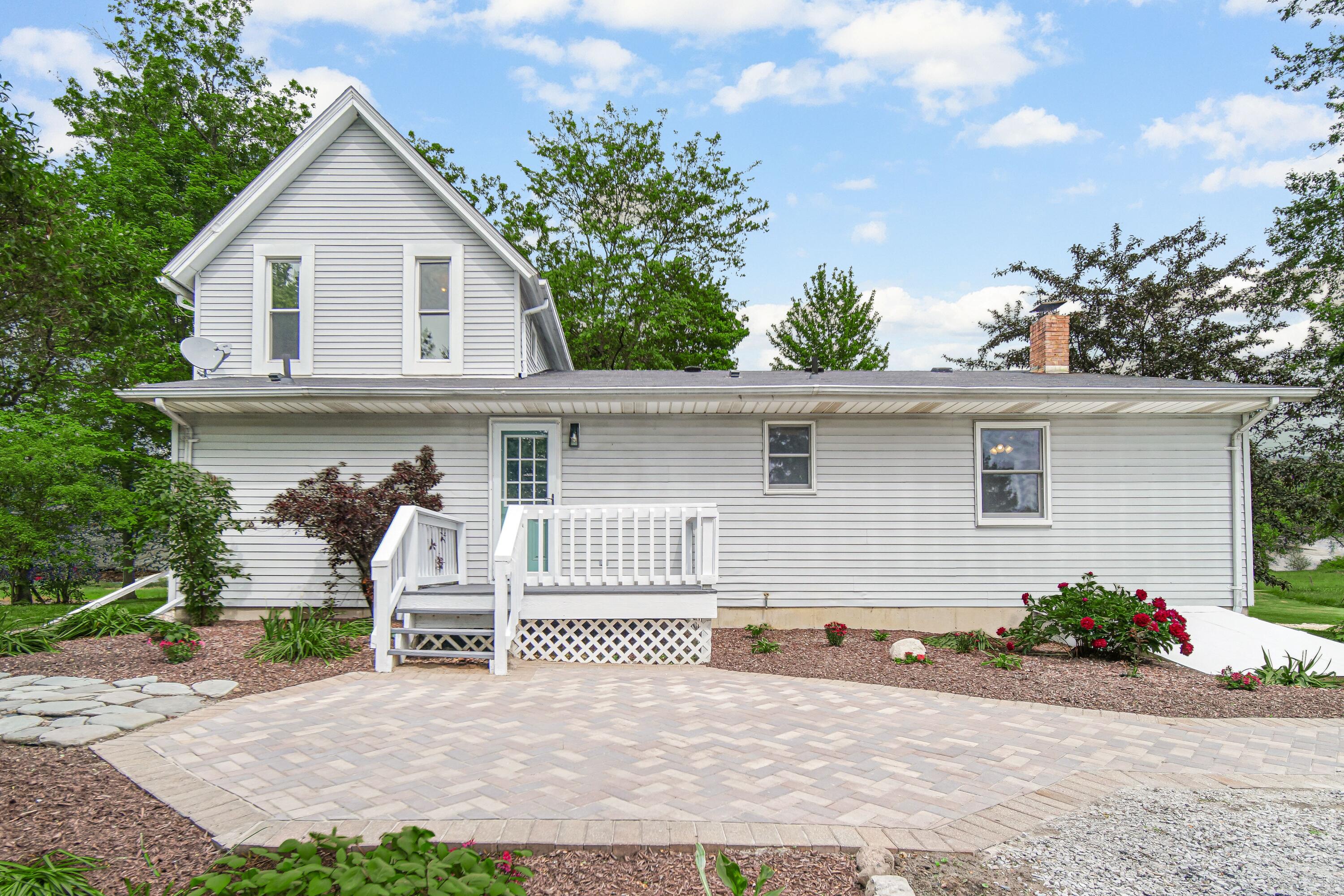 476 Highway 2 Hebron, IN 46341 - Photo 21 of 25 a view of a house with a yard and potted plants