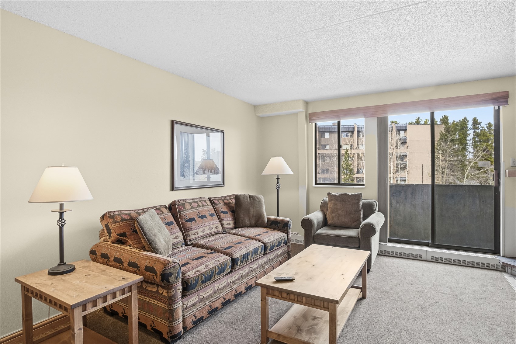 611 Village Road, Unit 24260 Breckenridge, CO 80424 - Photo 3 of 50 a living room with furniture and a lamp
