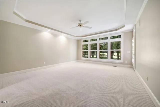 an aerial view of a house with a garden and swimming pool