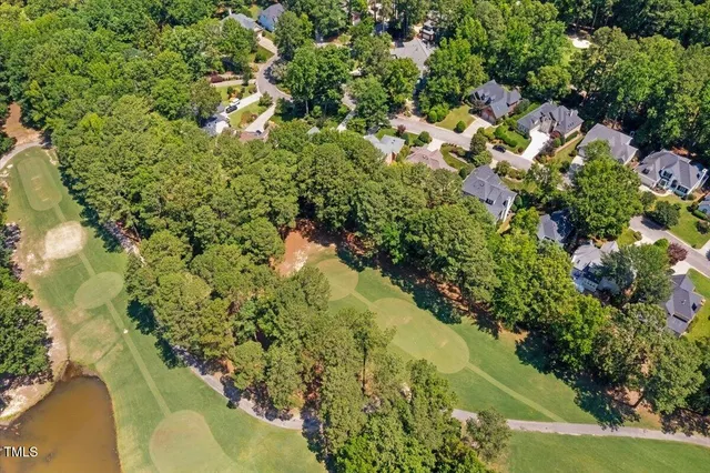 a view of a backyard with sitting area