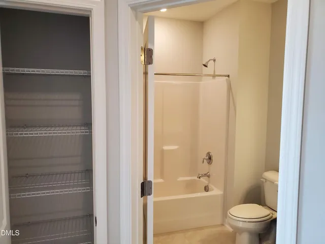 a view of a room with storage and racks on wall