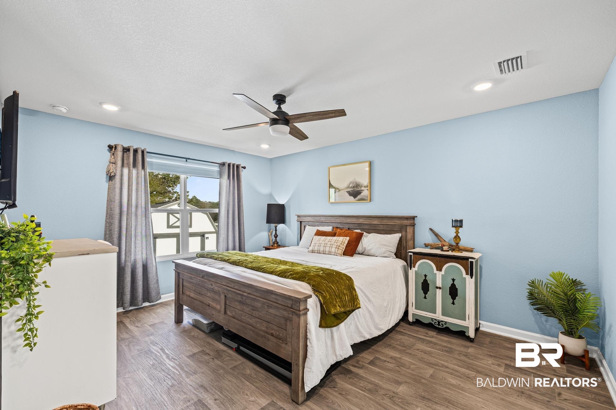 3078 Camino Real Loop Lillian, AL 36549 - Photo 11 of 51 Bedroom with dark wood-style flooring and a ceiling fan