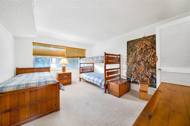 a bedroom with furniture and window