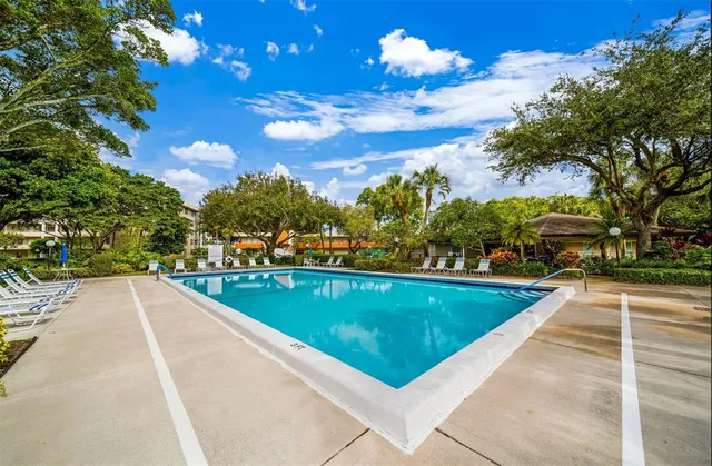 a view of swimming pool from a balcony
