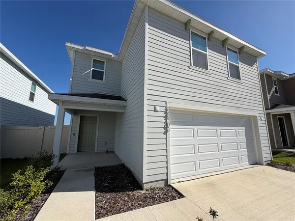 a front view of a house with a garage