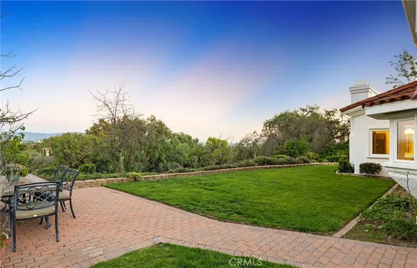 a view of a patio with a yard