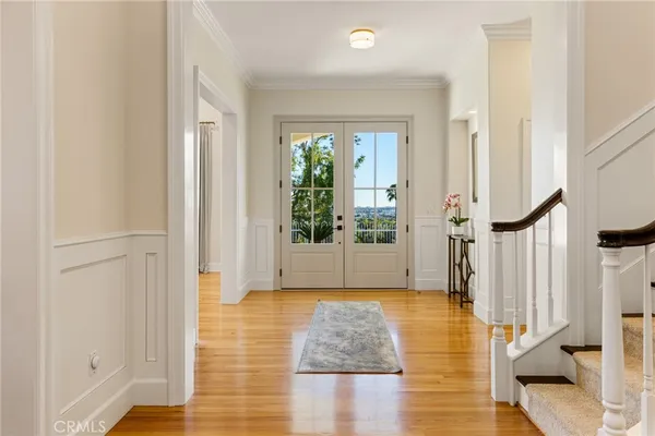 a view of entryway with wooden floor and garden
