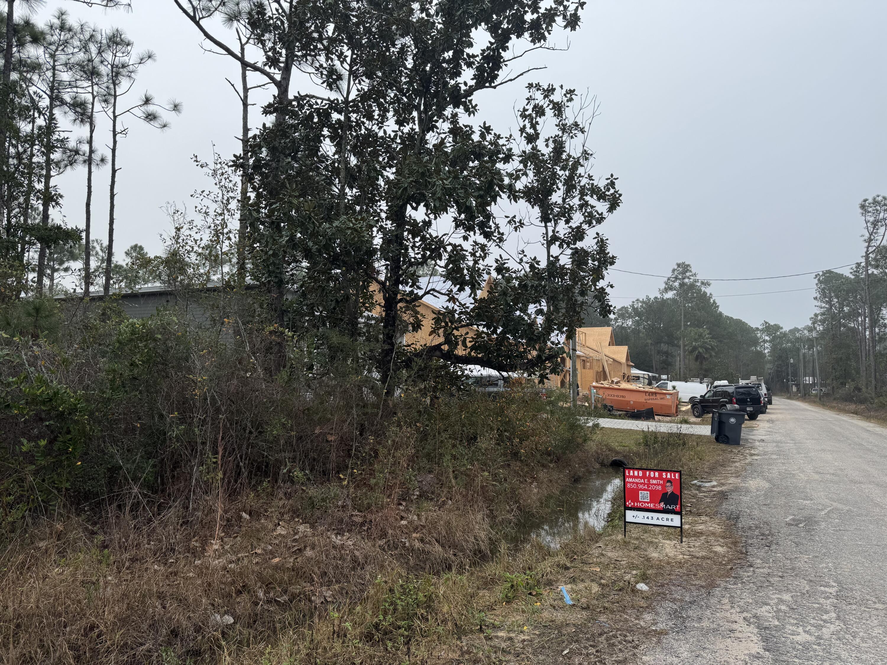0 L Street Santa Rosa Beach, FL 32459 - Photo 2 of 6 a wooden bench sitting in the middle of a forest