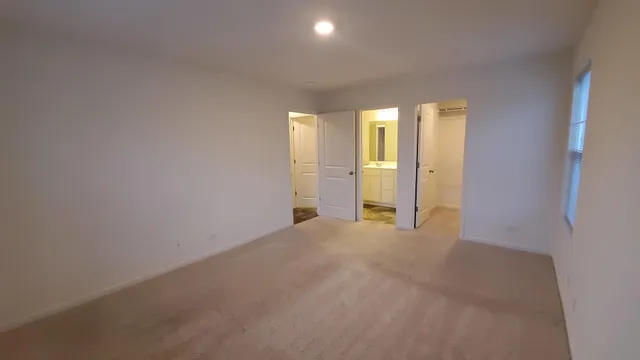 a view of empty room with windows