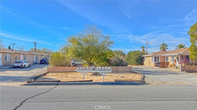 a view of a house with swimming pool and sitting area