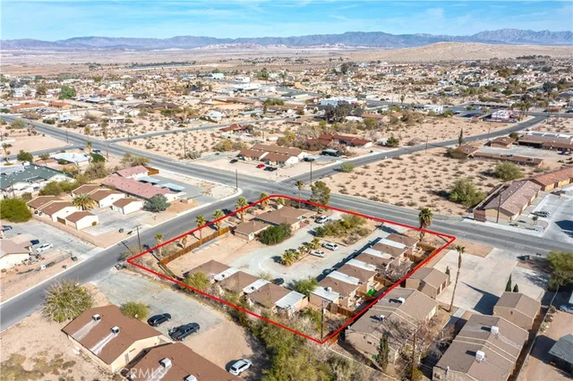 an aerial view of residential houses with outdoor space