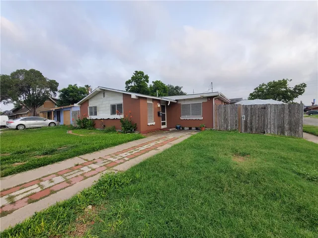 a view of house with backyard and entertaining space