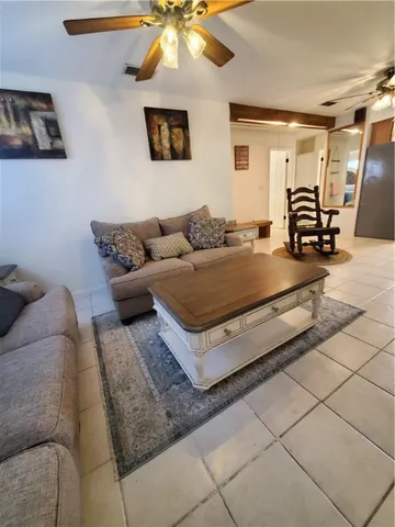a living room with furniture and a table