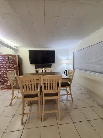 a kitchen with granite countertop a refrigerator and a sink