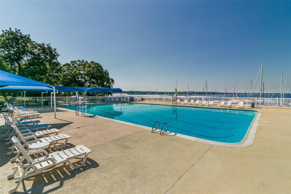 5411 Ranger Drive Rockwall, TX 75032 - Photo 23 of 25 a view of a swimming pool with a patio and a yard