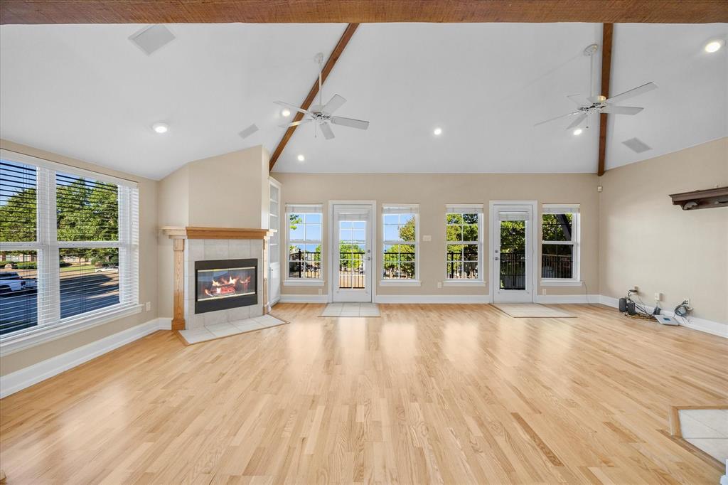 5411 Ranger Drive Rockwall, TX 75032 - Photo 5 of 25 a view of an empty room with wooden floor and a window