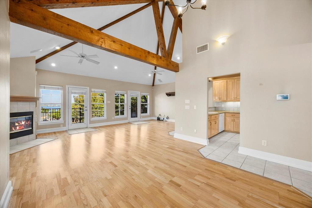 5411 Ranger Drive Rockwall, TX 75032 - Photo 7 of 25 a view of an empty room with wooden floor and a window