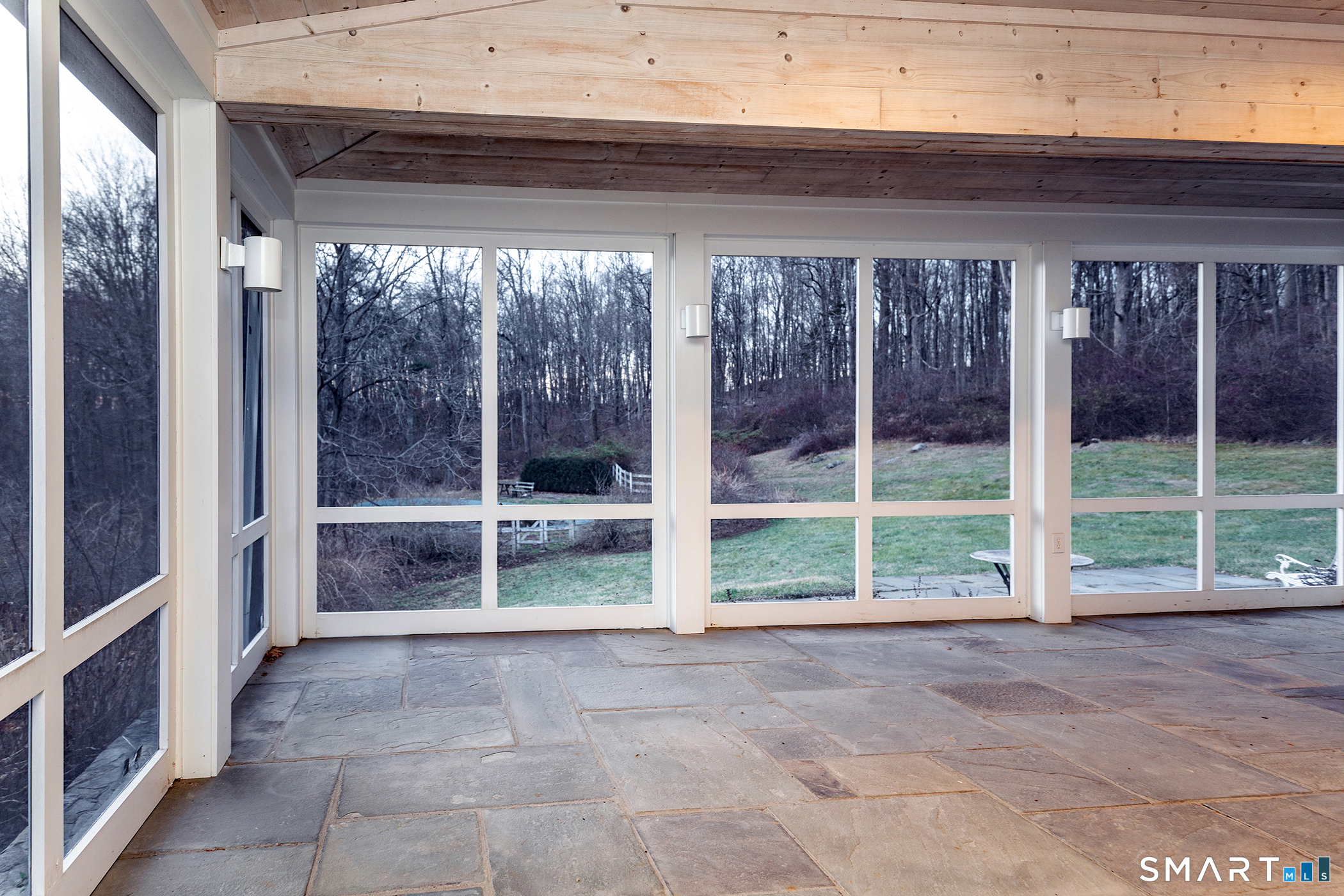 197 Skyline Ridge Road Bridgewater, CT 06752 - Photo 13 of 31 a view of empty room with wooden floor and windows