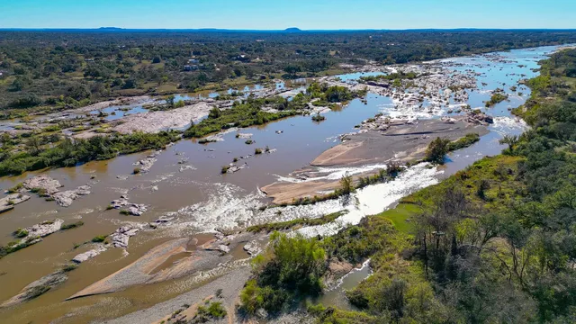 a view of a lake with green space