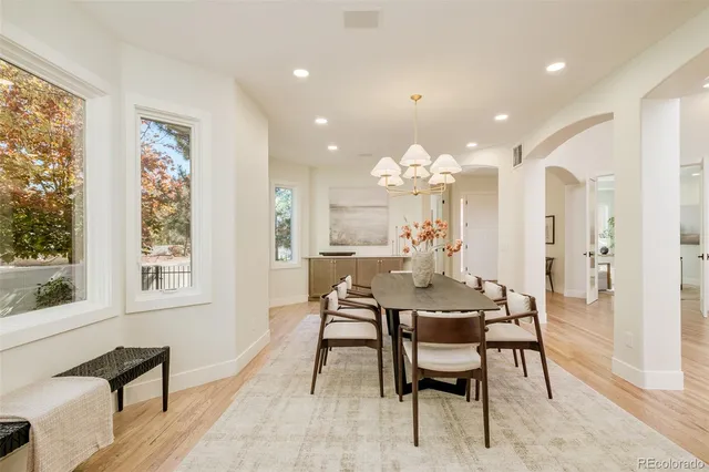 a spacious bedroom with a bed and a large window