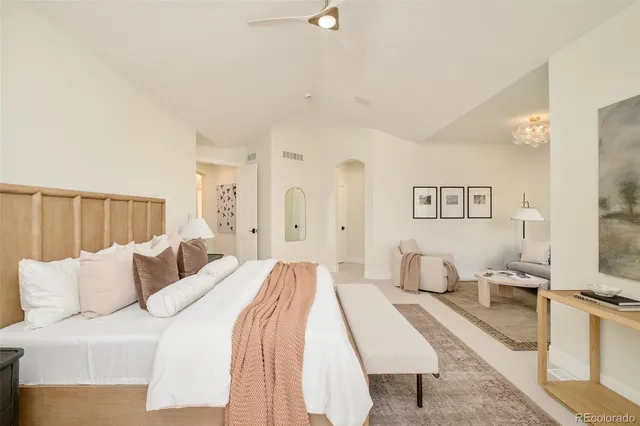 a living room with furniture a rug and a large mirror