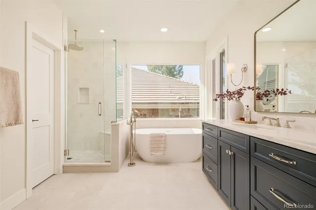 a bathroom with a shower and a bathtub