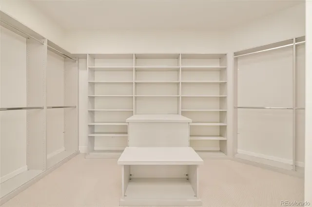 a view of a balcony with wooden floor and fence